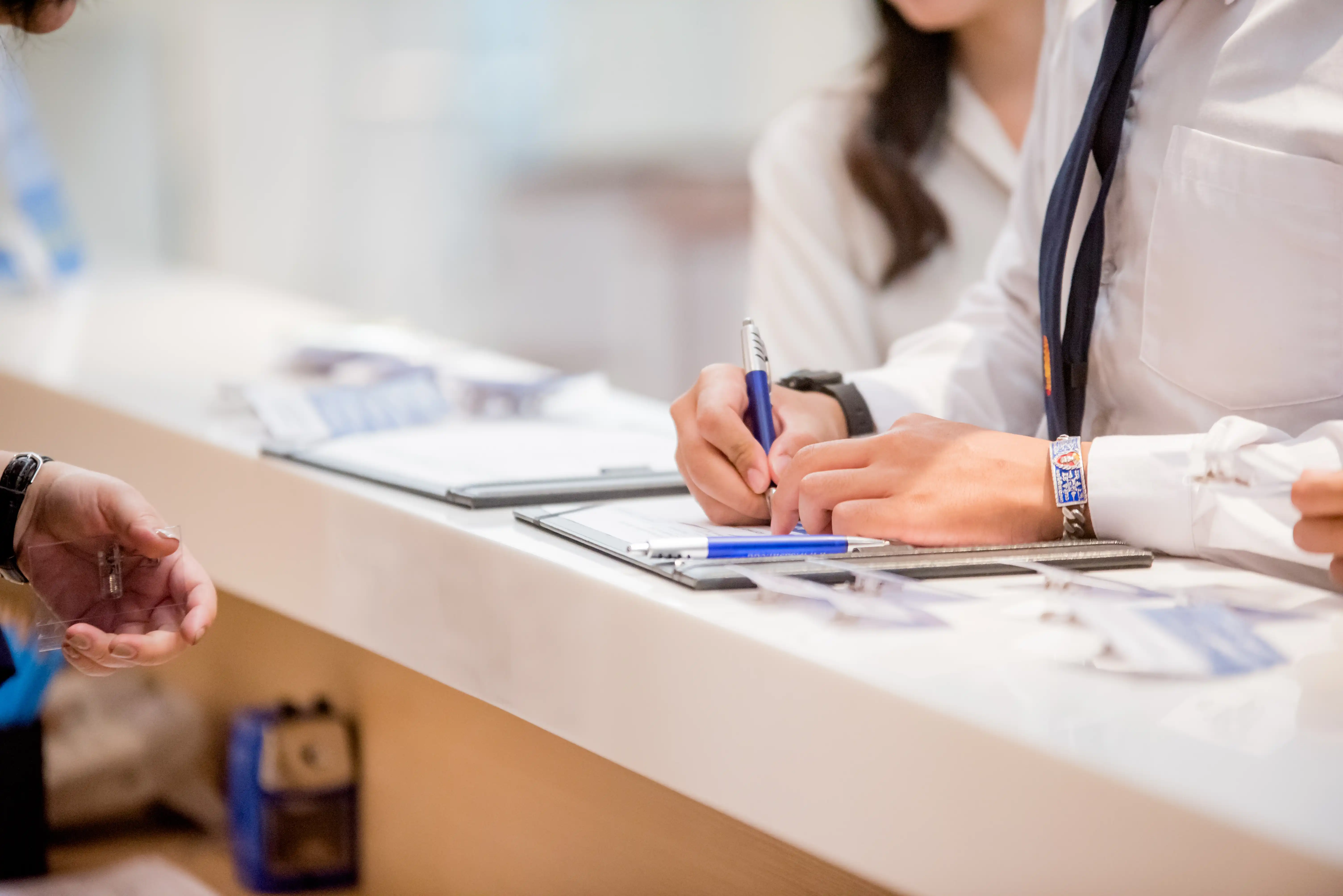 A person filling out paperwork